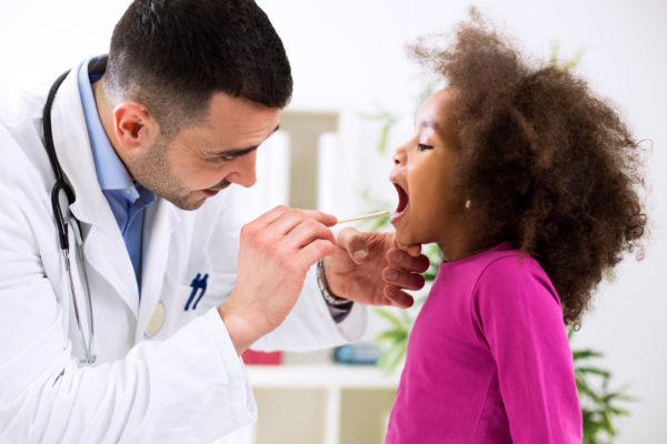 Doctor,Pediatrician,Examining,Cute,Smiling,African,Girl,,Throat,Sick